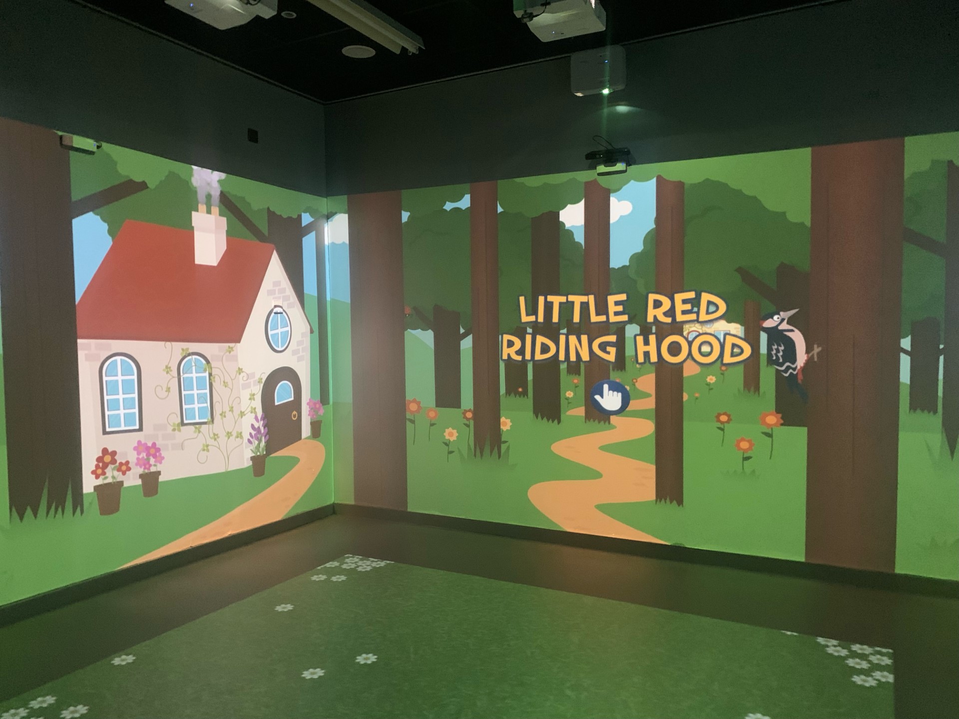 immersive room with little red riding hood on walls
